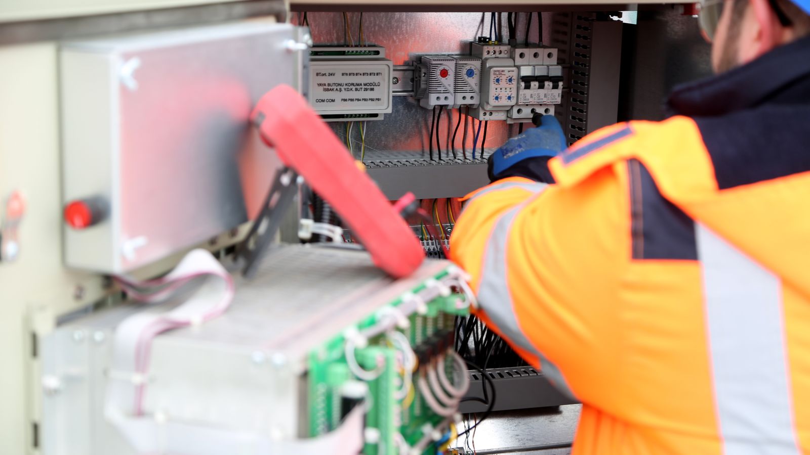 Electrician servicing an inverter and residential electrical system